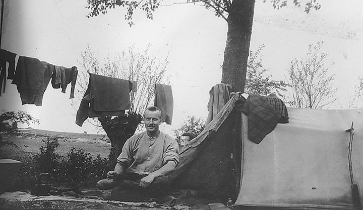 Corporal Irvine and his makeshift tailor’s shop at Bray in summer 1916